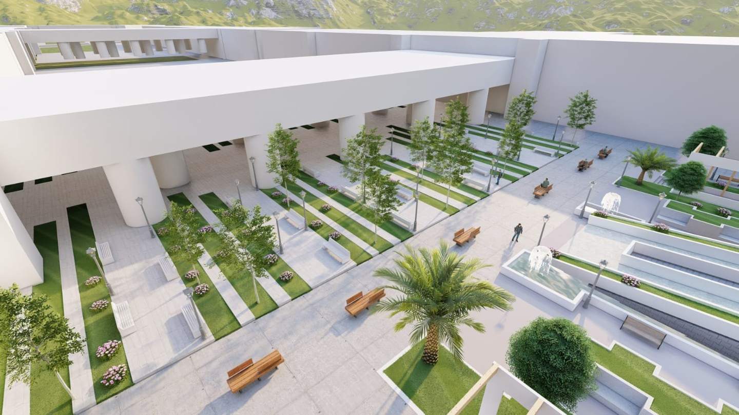 The plaza: strips of lawn and paving, trees and benches, leading to the colonnade