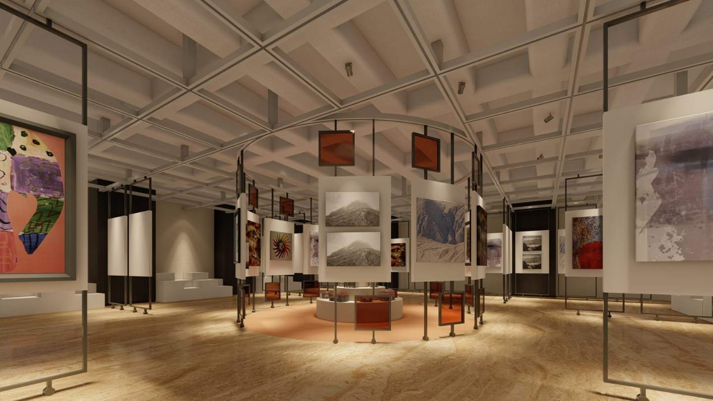 The ring of suspended panels and amber glass around the central models